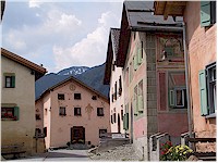 Houses in different colours along the road