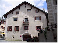 A house with traditional paintings and a small balcony