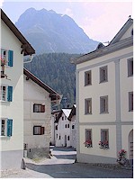 A narrow road passes through the old part of Scuol
