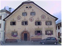 A pink house decorated with traditional paintings