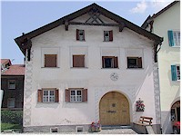 Small windows and a large entrance door are typical features of houses in this area