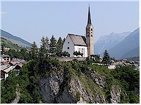 The church of Scuol resides high above the river En