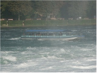 A boat in the spray of the Rheinfall