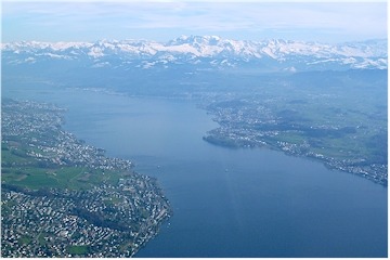 Aerial view towards the upper end of lake Zuerich with the alps in the background