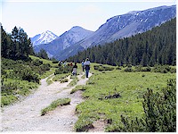 Valley Champloench - a small valley with a wide, easy to hike trail in the center and some mountains in the background