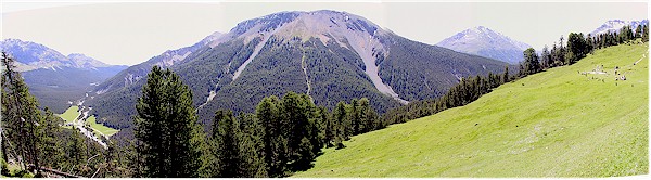 Panoramic view from Alp Grimmels - Il Fourn and the Pass dal Fuorn road on the left, Munt la Schera in the center and part of Alp Grimmels with the pick nic area on the right