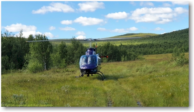 helikopter von fiskflyg in einer waldlichtung bei jaeckvik